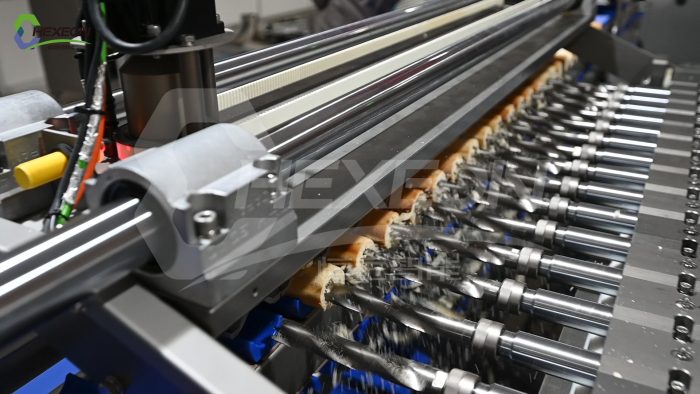 Automatic hot dog bun drilling machine